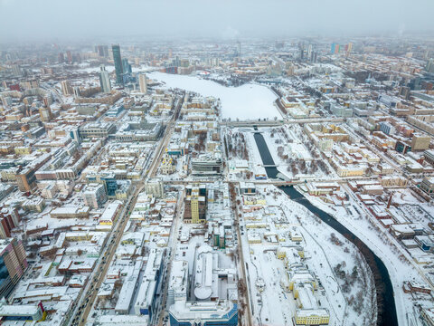 Embankment of the central pond and Plotinka in Yekaterinburg at winter sunset. The historic center of the city of Yekaterinburg, Russia, Aerial View