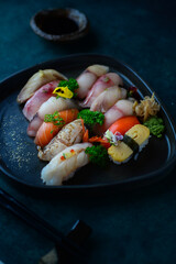 japanese traditional omakase service on a plate with nigiris and tamagoyaki