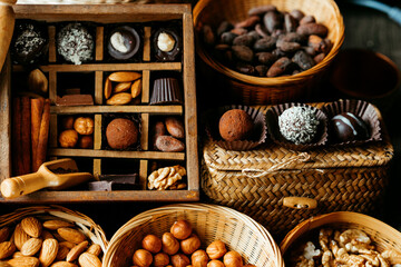 Handmade candies, nuts and spice inside of vintage box which devided on sections