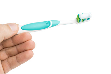 Hand holding toothbrush with toothpaste, isolated on white background