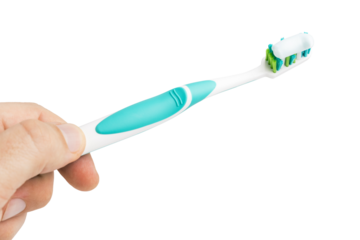 Hand holding toothbrush with toothpaste, isolated on white background