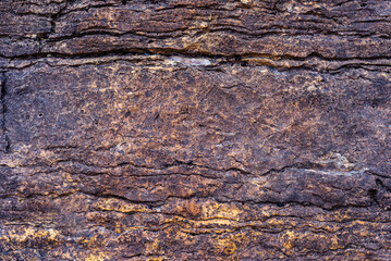 Dark brown old stone surface textured background