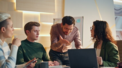 Boss arguing team meeting after phone call in workspace. Colleagues failed deal.