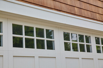 Classic White Windows and Cedar Shake Siding Detail