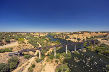 Fototapeta na wymiar Guadiana Railway Bridge near Beja, Moura Branch, National Route 260, Alentejo, Portugal