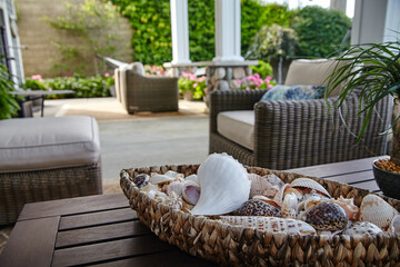 Coastal Patio Serenity with Seashells and Lush Greenery
