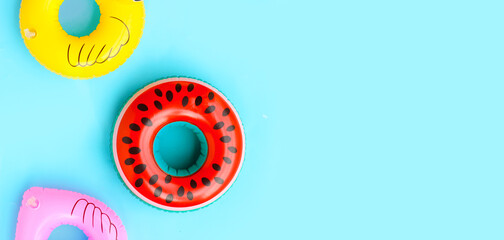 Inflatable rings on blue background.