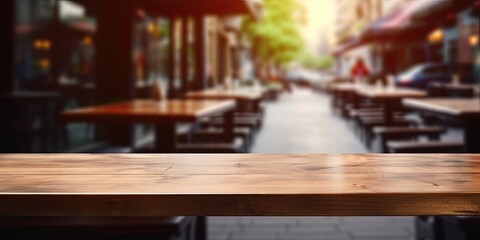 Wooden table with blurred coffee shop background, perfect for product displays or montages.