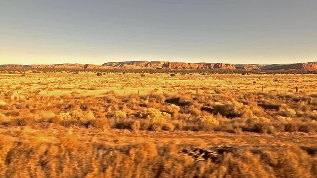 Desert Country.  The view from a train as it crosses desert between Gallup and Grants in New Mexico in the United States of America.