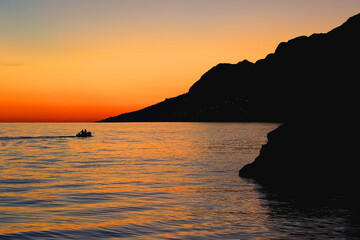 Beautiful sunset on the beach in Brela, Croatia.