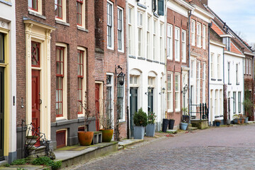 Street with historic houses in the medieval city of Zutphen. - obrazy, fototapety, plakaty