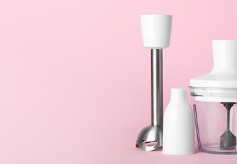 Electric hand blender on pink background. Top view. Space for text.