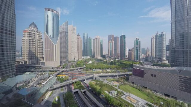 Crossroad traffic among skyscrapers at autumn day. Timelapse