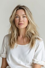 Blond woman against white background
