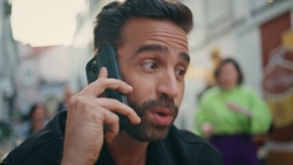 Angry macho arguing cellphone call city bar closeup. Nervous man calling phone