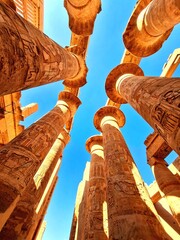 Hypostyle Hall with huge columns in Karnak temple in Luxor, Egypt. - obrazy, fototapety, plakaty