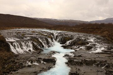 Obraz premium Bruararfoss is a waterfall in West Iceland which runs by the boundaries of municipalities Biskupstungur and Grímsnes