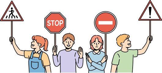 Young children hold traffic signs urging peers to follow safety rules walking streets. Happy preteen kids with street traffic signs recommend paying attention to problem of car accidents.