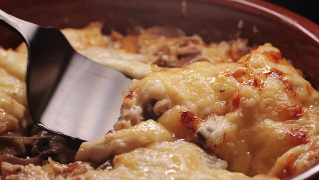 Melted cheese close up, melt pizza with cheese baking on tray in electric oven - macro, close up. Italian cuisine, homemade bakery, cooking food. 