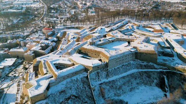 Fortress Klodzko and old town cityscape, aerial view. Famous historical landmark, fortification complex of the Lower Silesian Voivodeship. The biggest stronghold in Prussian Silesia. Winter panorama.