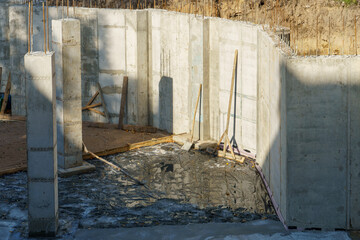 Building foundation construction. Monolithic concrete and reinforced concrete structures on the...