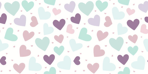 Seamless pattern with pastel green, pink and purple hearts on white background. Little hand drawn pattern with hearts for Valentines day, wedding. Wrapping paper, textile, background, wallpaper