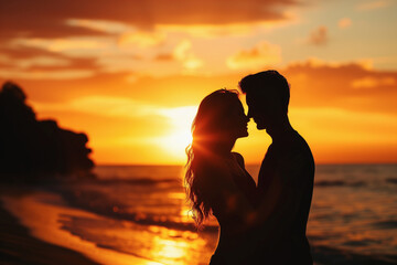 silhouette of a couple (man and woman) in love, in the sand at sunset