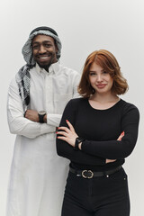 Muslim entrepreneur and a contemporary red-haired girl strike a pose together against a clean white background, embodying confidence, diversity, and a dynamic entrepreneurial spirit in their