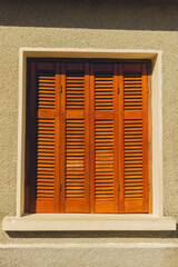 window with wooden shutters in an old house