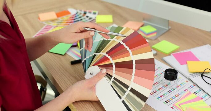 Female designer working with color palette samples