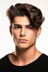 Fototapeta premium Beautiful model boy-man in a plain white studio, softly light. Suitable for diverse commercial projects