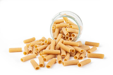 Whole durum wheat pasta. Pile of raw tortiglioni with glass jar isolated on white background.