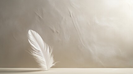  a white feather sitting on top of a table next to a white sheet of paper on top of a table.