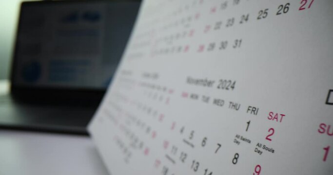 Closeup of white calendar for 2024 on table