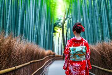 A Japanese woman in a kimono walking through a bamboo forest - Powered by Adobe