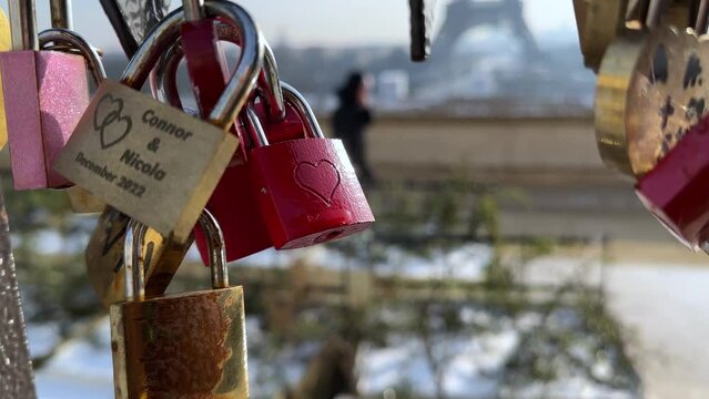 Paris, France, Eiffel Tower background, Valentine's day concept. Love locks attached to a bridge on the river Seine, Love symbols 