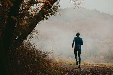 A Grey Autumn Palette Surrounds a Serene Young Trail Runner