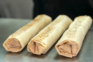 Getting to know street food, watching a street vendor, cooking food through glass cases, burritos, shawarma - street food.