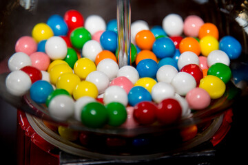 Interior of gumball machine with colorful gumballs