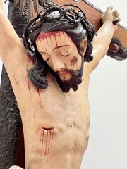 Close-up detail of the sculpture of Jesus Christ crucified on the cross
