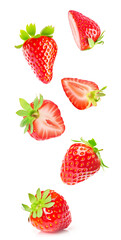 Fresh halved strawberries, vividly red with green leaves, levitating against white background