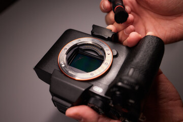 Cleaning the camera sensor with a blower for office equipment and electronics from contamination....