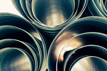 air ducts round different diameter on white isolated background, front and back background blurred - obrazy, fototapety, plakaty