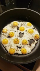 fried quail eggs in a frying pan