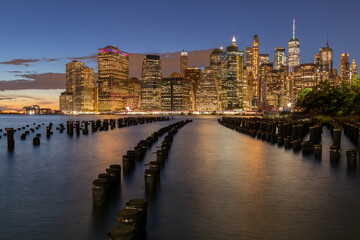 Beautiful Night Light and Lower Manhattan skyline with East River and New York City. Twilight with...