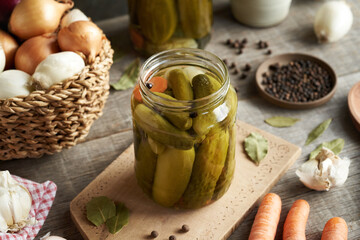 Homemade cucumber pickles or gherkins in a glass jar