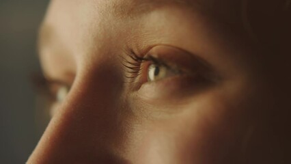 Close-up portrait of a young attractive woman opening her eyes and smiling - Powered by Adobe