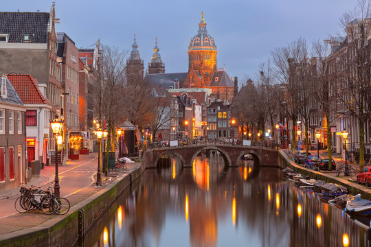 Canal De Wallen, famous red-light district in the twilight, Amsterdam, Holland, Netherlands.