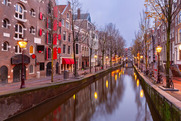 Empty De Wallen, famous red-light district, at morning blue hour, Amsterdam, Holland, Netherlands.