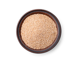 Dry wheat groats in bowl isolated on white, top view